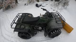 Plowing snow with a Honda fourtrax 300 4x4 atv [upl. by Eceinehs520]