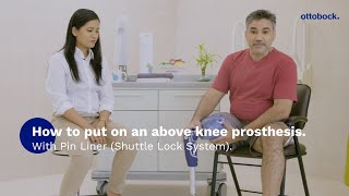 How to put on an above knee prosthesis with Pin Liner Shuttle Lock System  Ottobock [upl. by Alded]